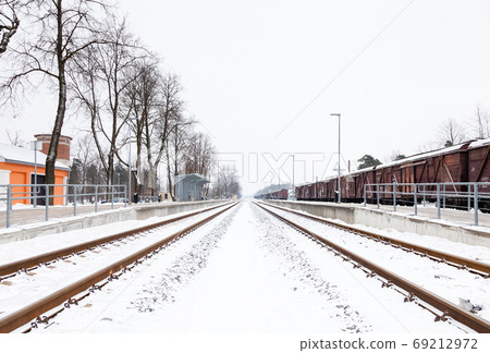 Snow Covered Railway Track. The view along a snow covered railway track in Sigulda, Latvia. 69212972