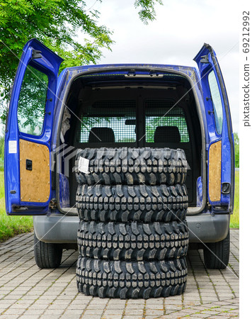 new set of mud and terrain tires at the delivery car new set of mud and terrain tires at the delivery car 69212992