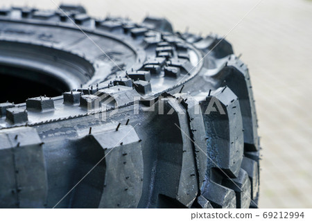 closeup view of new mud and terrain tire tread 69212994