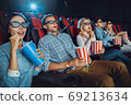 Young people friends together in the cinema 69213634