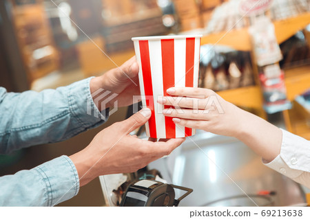 Young man going out to the cinema Young man going out to the cinema 69213638