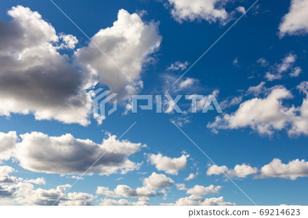 Beautiful View of Puffy White Clouds with blue Sky in Background 69214623