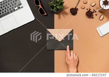 Workspace coffee design human hand point to envelop Workspace coffee design human hand point to envelop 69217247