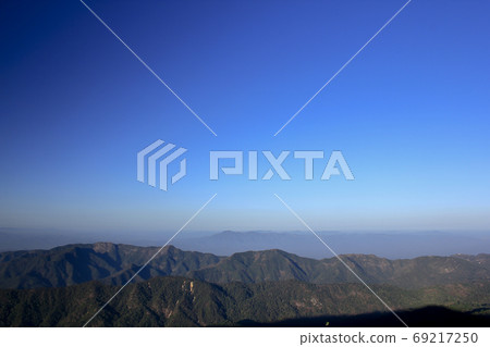 Landscape mist-covered mountains in the morning. Landscape mist-covered mountains in the morning. 69217250