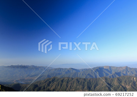 Landscape mist-covered mountains in the morning. Landscape mist-covered mountains in the morning. 69217252