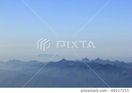 Landscape mist-covered mountains in the morning. 69217253