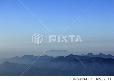 Landscape mist-covered mountains in the morning. Landscape mist-covered mountains in the morning. 69217254