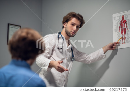 Cropped shot of a patient discussing his illness with his doctor Cropped shot of a patient discussing his illness with his doctor 69217373