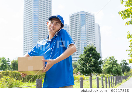 Sales driver man delivering luggage 69217818