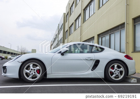 Big hospital building with white car and sky Big hospital building with white car and sky 69219191