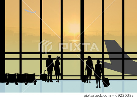 People at the airport at sunset 69220382