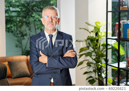 Confident serious entrepreneur Confident serious entrepreneur 69220821