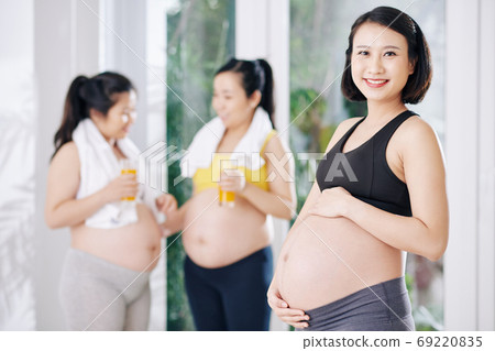 Cheerful pregnant Asian woman 69220835