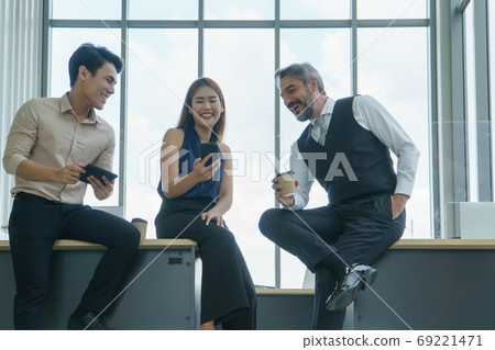 group of businesspeople talking 69221471
