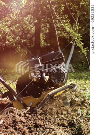 Spring garden outdoor works motor cultivator in process vertical Spring garden outdoor works motor cultivator in process vertical 69222033