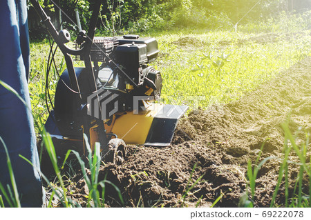 Outdoor garden plow job with motor cultivator Outdoor garden plow job with motor cultivator 69222078