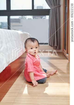 Girl sitting on the floor Girl sitting on the floor 69222138