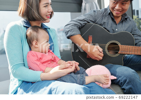 Girl enjoying song of father 69222147