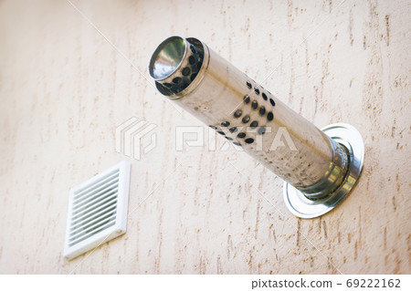 Munich plaster wall with gas chimney and ventilation hole 69222162