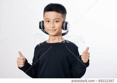 Vietnamese boy in headphones Vietnamese boy in headphones 69222267