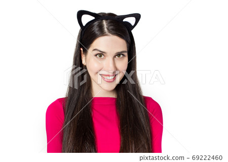 Smiling white black haired beautiful young woman with cat ears head bend 69222460