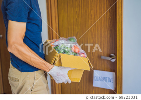 Home delivery food during virus outbreak, coronavirus panic and pandemics. Stay safe Coronavirus covid-19 quarantine sign at Front door, quarantine sign at home 69223031