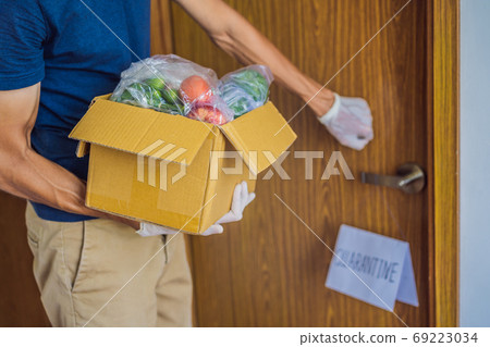 Home delivery food during virus outbreak, coronavirus panic and pandemics. Stay safe Coronavirus covid-19 quarantine sign at Front door, quarantine sign at home Home delivery food during virus outbreak, coronavirus panic and pandemics. Stay safe Coronavirus covid-19 quarantine sign at Front door, quarantine sign at home 69223034