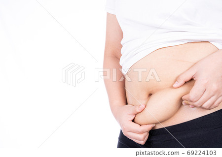 Fat woman holding excessive fat belly, overweight fatty belly isolated on over white background. 69224103