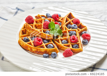 oatmeal banana waffles with berries, top view oatmeal banana waffles with berries, top view 69224185