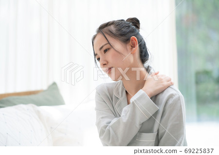 Tired woman sleep deprived stiff shoulder Tired woman sleep deprived stiff shoulder 69225837