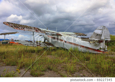 Old crashed and abandoned small propeller plane at the airplane Old crashed and abandoned small propeller plane at the airplane 69227345