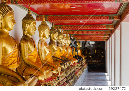 Veranda of Gild Buddha Sculptures at Wat Pho, Bangkok of Thailand. Veranda of Gild Buddha Sculptures at Wat Pho, Bangkok of Thailand. 69227472