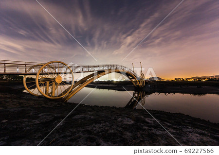 Bicycle bridge in ecological park 69227566