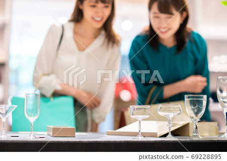 A young woman shopping shopping with g GIFT AND LIFESTYLE A young woman shopping shopping with g GIFT AND LIFESTYLE 69228895