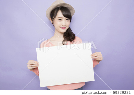 A woman with a message board 69229221