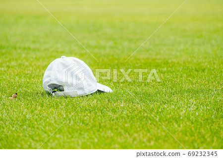 White hat on green White hat on green 69232345