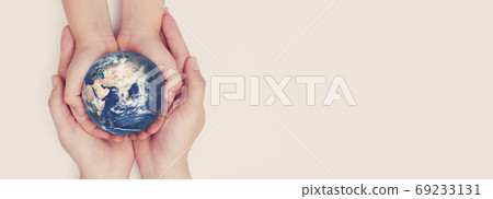 Earth globe in family hands. World safety 69233131