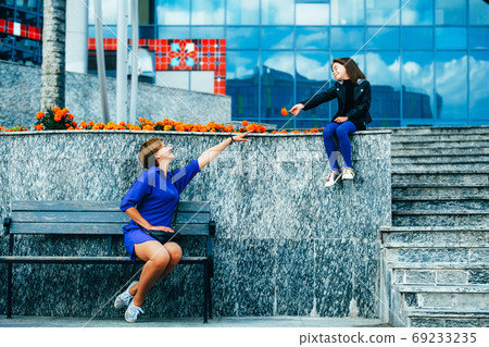 Happy mother and daughter in urban setting Happy mother and daughter in urban setting 69233235