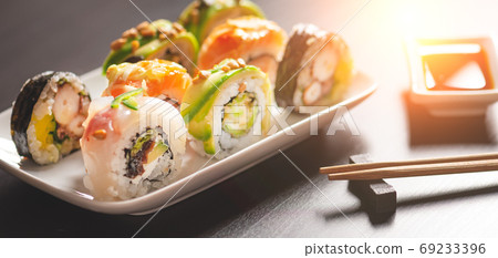 Traditional sushi roll set on plate Traditional sushi roll set on plate 69233396