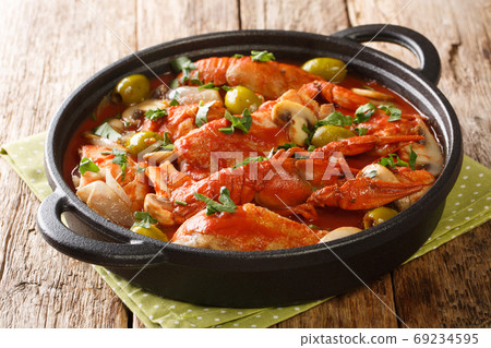 One pot Chicken Marengo with crayfish, mushrooms, olives, garlic 69234595