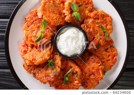 Tomatokeftedes are fried tomato balls served as an appetizer on Tomatokeftedes are fried tomato balls served as an appetizer on 69234608