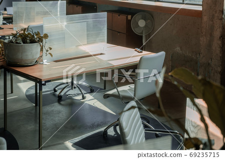 Co-working space with separated boards social distancing 69235715