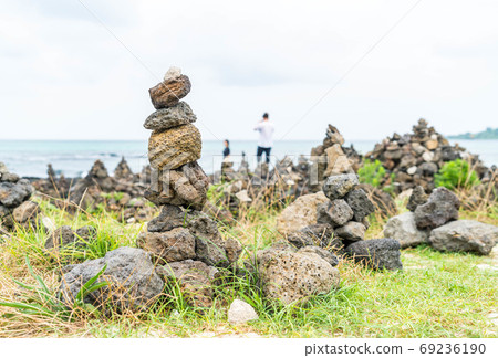 stone towers on basaltic rocks at Hyeopjae Beach,Jeju Island 69236190
