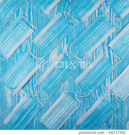 Medical masks on the blue colored background Medical masks on the blue colored background 69237992