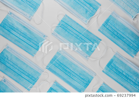 Medical masks on the blue colored background Medical masks on the blue colored background 69237994