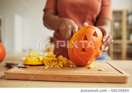 Unrecognizable Woman Carving Pumpkin Unrecognizable Woman Carving Pumpkin 69239884