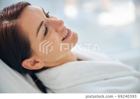 Good-looking spa client with a pleased smile Good-looking spa client with a pleased smile 69240393