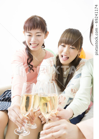 A woman toasting 69241174