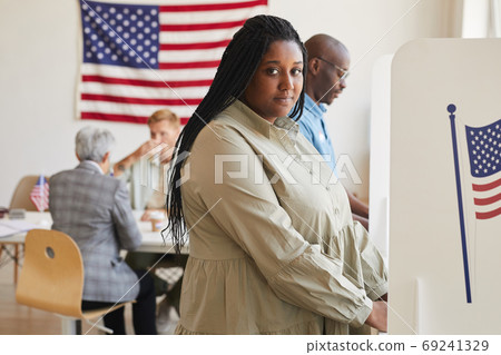 African-American Woman in Voting Booth 69241329