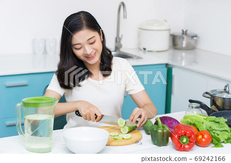 Woman cooking Woman cooking 69242166